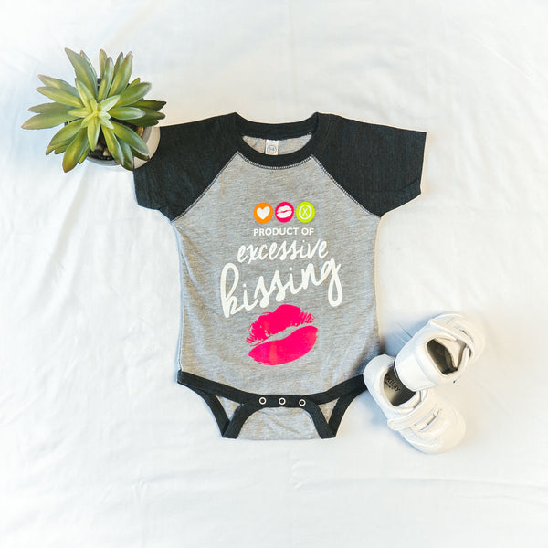 ‘Product of excessive kissing’ baby onesie